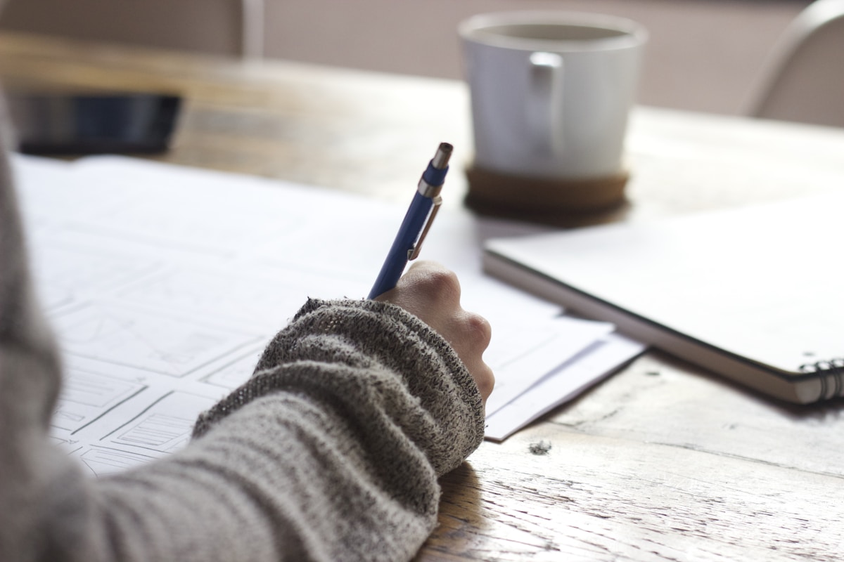 Skills notebook and desk setup used during AI income circuit module planning